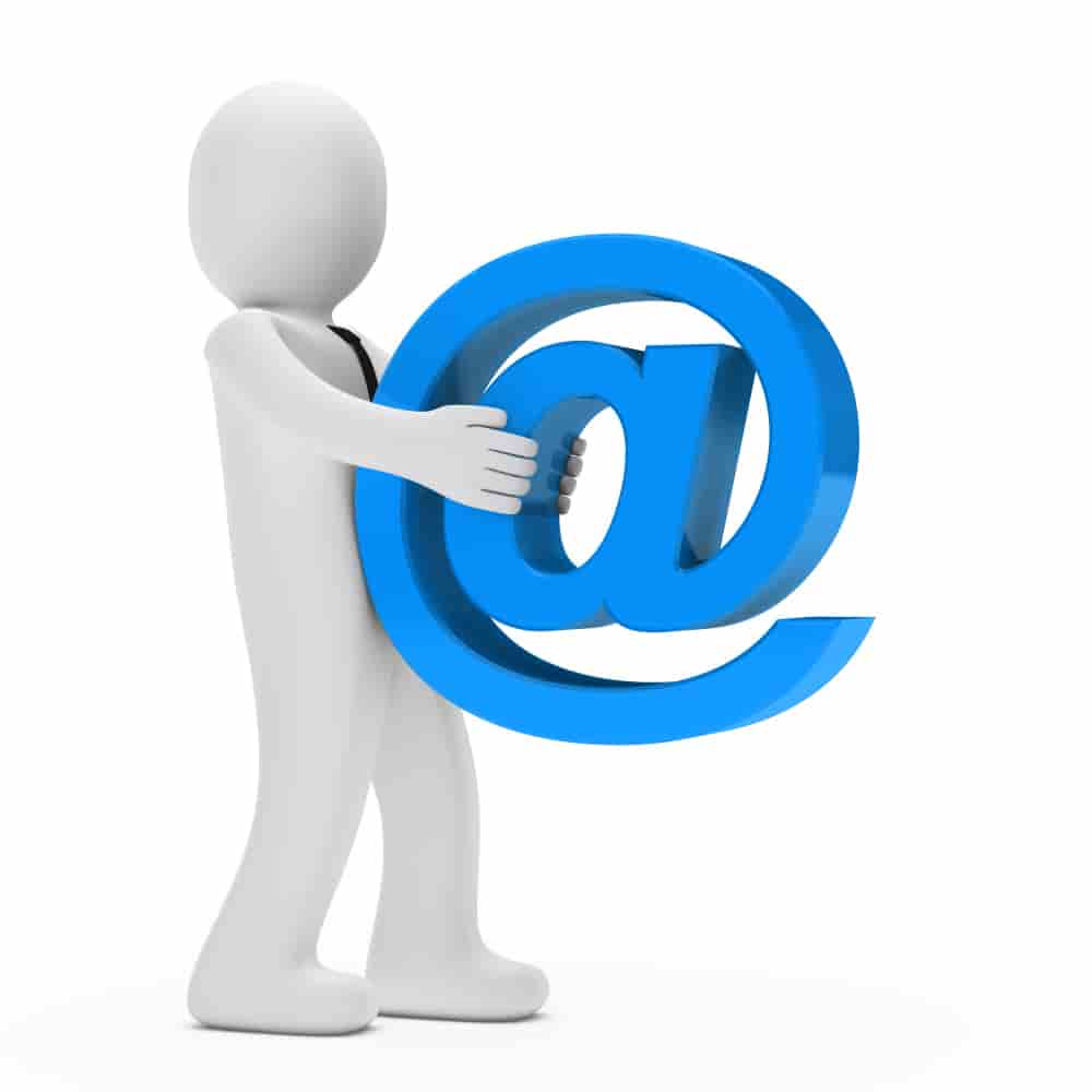 a person holding a blue at sign